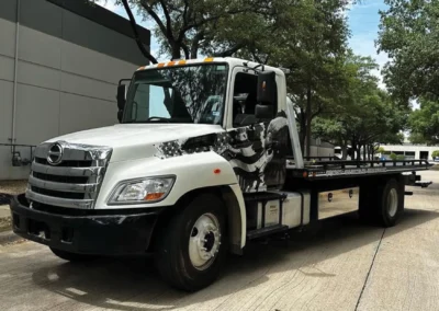 Close-up of custom eagle and flag graphics on DMR Towing vehicle wrap.